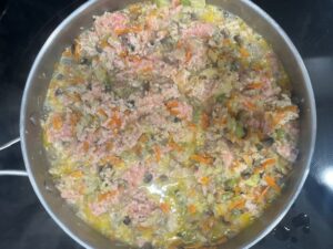 Ground turkey cooking with onion, carrot, celery, and mushrooms for AIP Zucchini Boats, a gluten free, dairy free, nightshades free recipe.