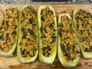 Baked AIP Zucchini Boats filled with turkey, kale, and vegetables, gluten free, dairy free, nightshades free, perfect for gut health.