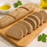 Gluten Free AIP Baguette Bread made with tigernut, green banana, and sweet potato flour on rustic board with olive oil and parsley. Free of grain, eggs, soy, sugar, nightshades.