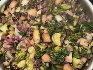Rainbow Veggie Stew simmering with kale zucchini broccoli parsnips mushrooms and purple cabbage in a rich anti-inflammatory AIP vegetable blend.