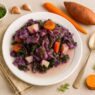 Sweet Potato Cabbage Stew with carrots, kale, and fresh dill on a white plate, gluten free, dairy free, and nightshade free.