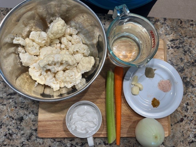 AIP Cauliflower Cream Soup ingredients including cauliflower, coconut cream, celery, carrot, garlic, kelp, and spices for a dairy free anti-inflammatory soup.