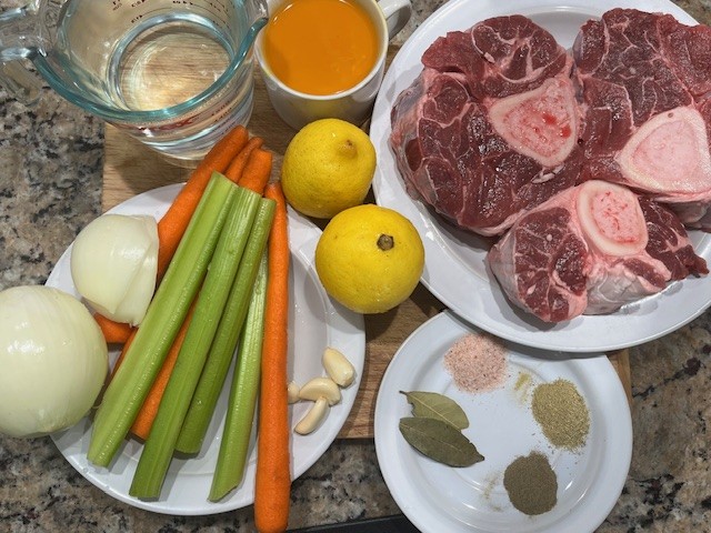 Best AIP Osso Buco ingredients including beef shanks, carrots, celery, onion, garlic, lemon, bay leaves, spices, and broth.