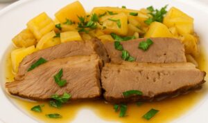 Best AIP Mouth-Melting Brisket with Sweet Potatoes and Herbs on a white plate. Gluten free, dairy free, soy free, nightshade free, and paleo friendly slow-baked AIP meal topped with fresh parsley.