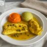 Healthiest AIP chicken piccata with bright carrot and asparagus purées, tender chicken in lemon caper sauce, served on a white plate for an autoimmune-friendly meal.